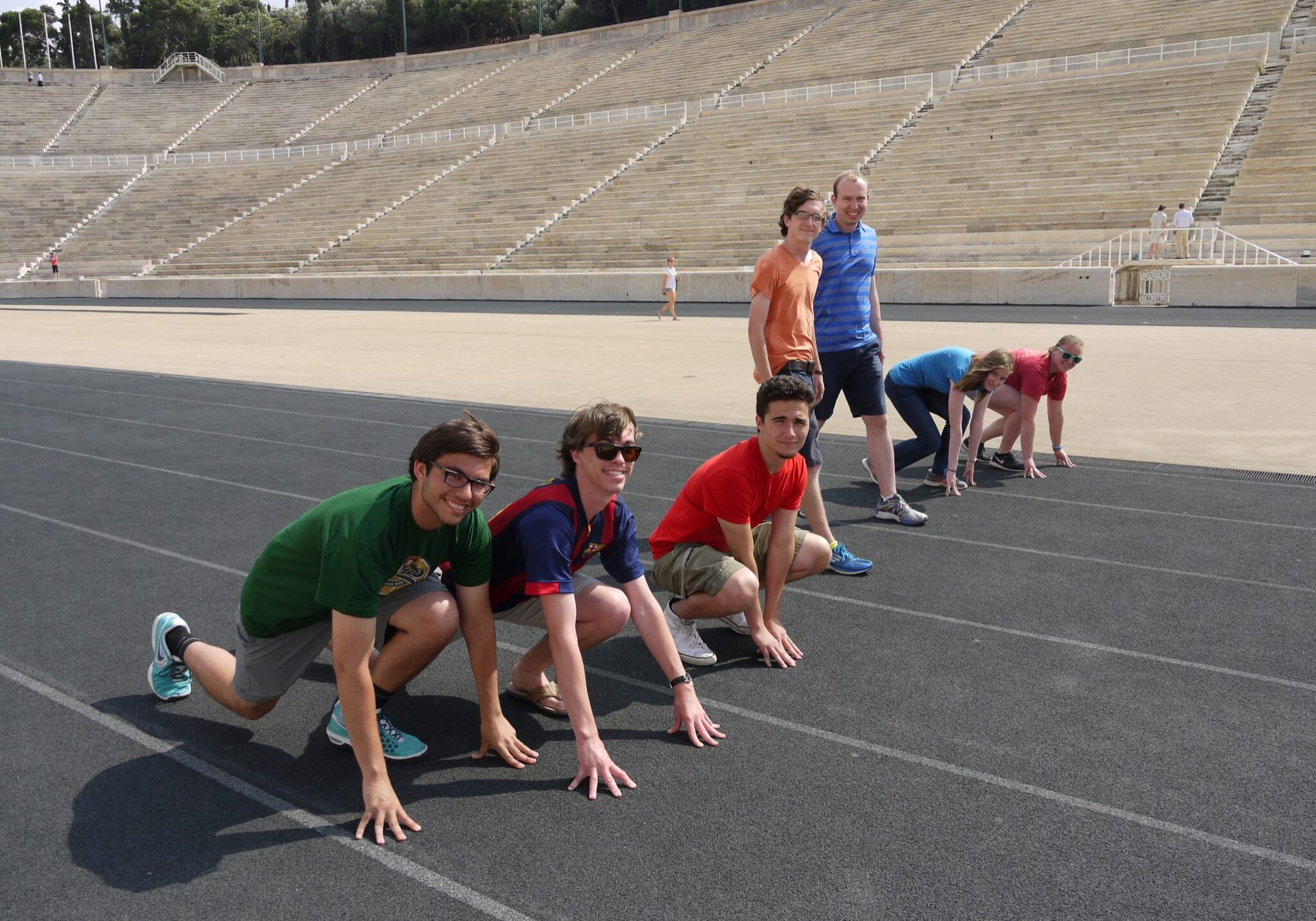 <p>Photo of Professor Geoffrey Benson</p><p>preparing to race in the Olympic Stadium</p><p>at Athens with students. June 2015.</p>